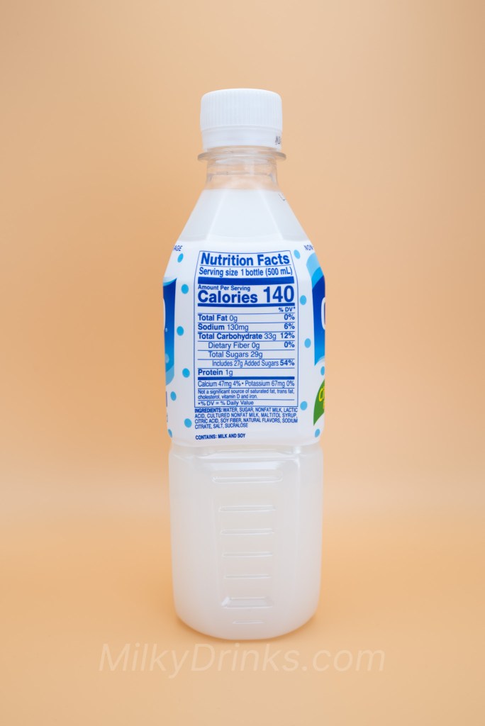 Calpico Original / Calpis Water bottle with nutrition label in display, on a peach background