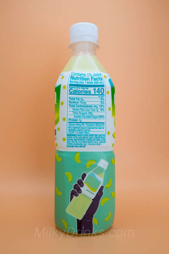 Calpico Melon drink bottle displaying the nutritional label on a peach background
